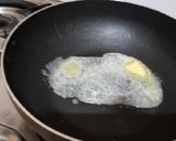 A picture of step 3 of Mall PVR style spicy corn black salt butter masala.