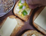 A picture of step 3 of Corn 🌽 Capsicum 🫑 Cheesy Toast.