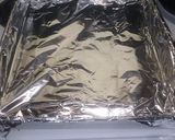 A picture of step 1 of Baked Bisquick Crunchy Drumsticks.