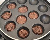 A picture of step 12 of Healthy Atta Jaggery Muffins in Appe Pan.