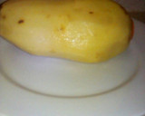 Foto del paso 1 de la receta: Papa rellena bañada en salsa de tomate con cebolla cambray