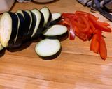 A picture of step 2 of Beef and grilled aubergine red curry topped with Bird eye chillis.