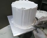 A picture of step 7 of 8 inch tall chocolate brownie cake.
