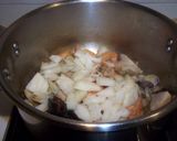 Foto del paso 7 de la receta: Arroz caldoso de calamares y alcachofas