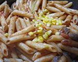 A picture of step 6 of Penne ai funghi (Penne in Mushroom Sauce).