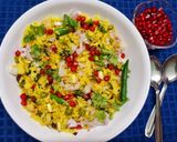 A picture of step 4 of Poha with Potatoes Peas and Pomegranate.