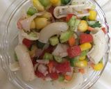 A picture of step 2 of Greek layered elbow pasta salad.