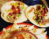 A picture of step 5 of Shawarma with homemade hummus.