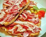 Foto del paso 3 de la receta Medias Tostadas con Jamón Ibérico y Tomate.