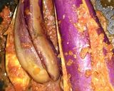 A picture of step 2 of Kashmiri Khatte Baigan with Khasta Puri.