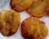 A picture of step 5 of Patacones or Tostones with minced chicken topping.
