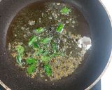 A picture of step 4 of Proso millet with spinach green peas Dalia.