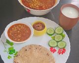 A picture of step 9 of Kathiyavadi lunch :Fresh lobiya Curry, Roti, Cucumber Slices, Pickle & buttermilk.