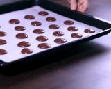 A picture of step 5 of Chocolate Macarons with a White Chocolate Ganache filling.