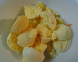 A picture of step 10 of Buttery broccoli salad topped with deviled eggs.