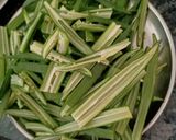 A picture of step 1 of Kurkuri Bhindi (Fried Okra).