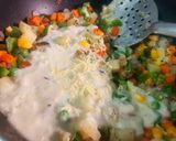 A picture of step 4 of Baked Sweet Corn and Vegetables in White Sauce.