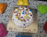 A picture of step 12 of Holi special Vanilla colourful cake.