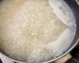 A picture of step 1 of Saucy Crispy chicken with rice fries and vegetable.
