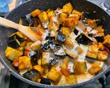 A picture of step 13 of Eggplant Curry with Mushrooms, Tomatoes, and Coconut Milk.
