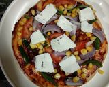 A picture of step 2 of Cheesy paneer pizza.