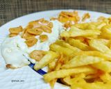 Foto del paso 5 de la receta Patatas fritas con huevos y ajos