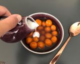 A picture of step 7 of Kolak Biji Salak - Sweet potato balls in palm sugar syrup and coconut milk.