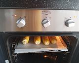 Foto del passaggio 4 della ricetta Pannocchie (di mais) al forno