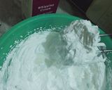 A picture of step 2 of Vanilla cream cake with chocolate chips inside.