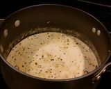 A picture of step 8 of Crab and Shrimp Enchiladas with Hatch Chili Sauce.