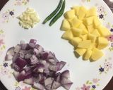 A picture of step 1 of Aloo Bhindi Fry.