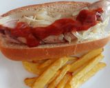 A picture of step 3 of Frankfurter and bratwurst mixed grill with my currywurst sauce.