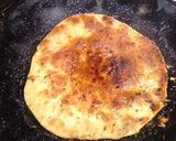 A picture of step 4 of Coconut stuffed parandaa.