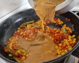 A picture of step 3 of Corn capsicum paneer in yellow gravy using premix.