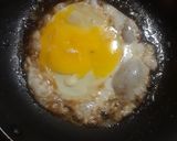 A picture of step 3 of 15 Cent Diner Fried Egg Sandwich with cheese.