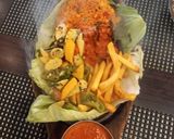 A picture of step 9 of Paneer Shashkik Sizzler with Schezwan Corn Rice.