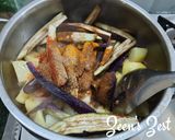 A picture of step 1 of Long Purple Brinjal and Potatoes Sabzi.