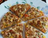 A picture of step 11 of Cheesy Mexican Veg Pizza.