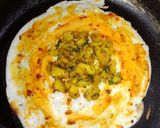 A picture of step 4 of Shezwan masala cheese Dosa roll.