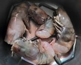 A picture of step 1 of Chingri macher malai curry (Prawn malai curry Bengali special).