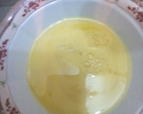 A picture of step 5 of Steamed rice with scrambled eggs and cucumber salad.