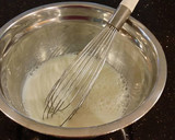 A picture of step 12 of White Layer Cake with a Raspberry Swirl Cheesecake center layer and a Raspberry Cream Frosting.
