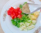A picture of step 3 of Ajwain leaf salad with veggies and pineapple.