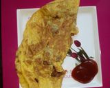 A picture of step 6 of Inda na puda (stuff egg omelette).