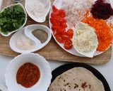 A picture of step 1 of Cheesy Chapati Pizza.