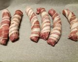 A picture of step 1 of Pigs in blankets, mash and onion gravy.