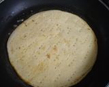 A picture of step 6 of Thin Crust whole wheat Bread Pizza with pizza sauce.