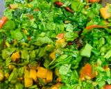 A picture of step 2 of Palak with brinjal and badi.