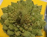 A picture of step 1 of Air-fryer romanesco broccoli cauliflower done two ways.