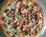 A picture of step 4 of Chicken tikka pizza.